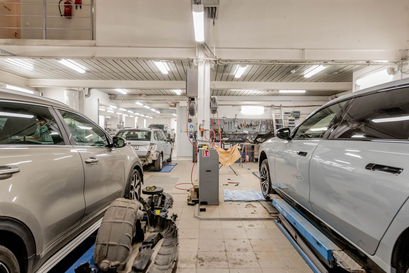 Working service bays with vehicles in for repair